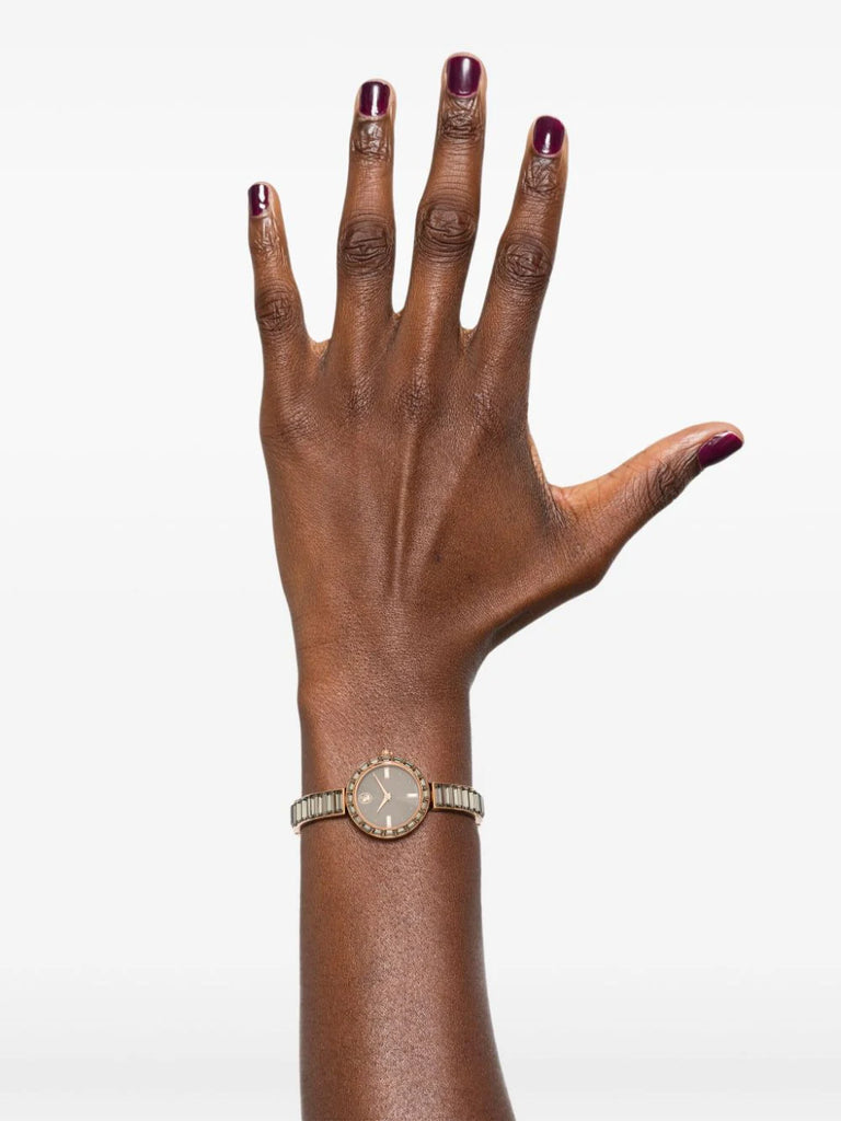 A model is wearing is wearing a Swarovski Matrix Bangle Watch