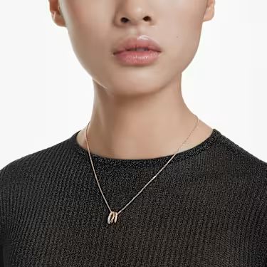 Model wearing a rose gold Swarovski necklace