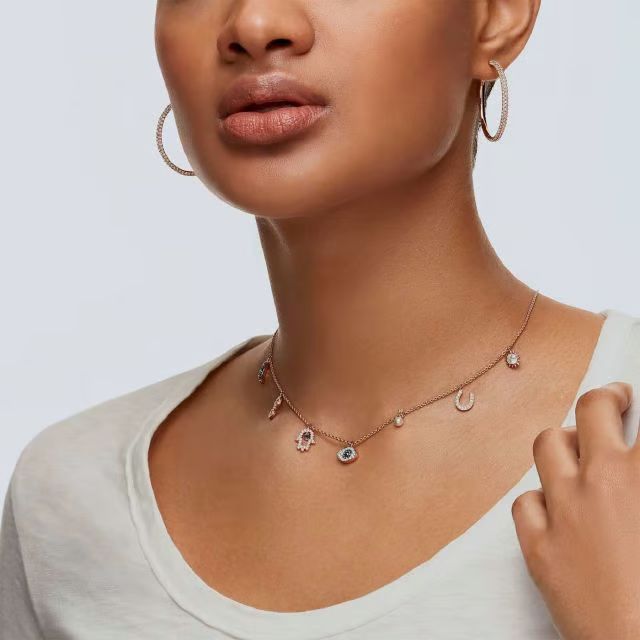 A model is wearing the Swarovski Symbolica chocker necklace