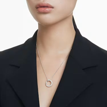 Model wearing a black blazer and the Swarovski Dextera pendant