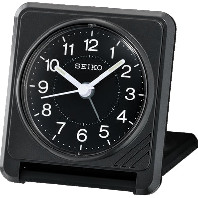 Black Seiko travel alarm clock with white numbers.