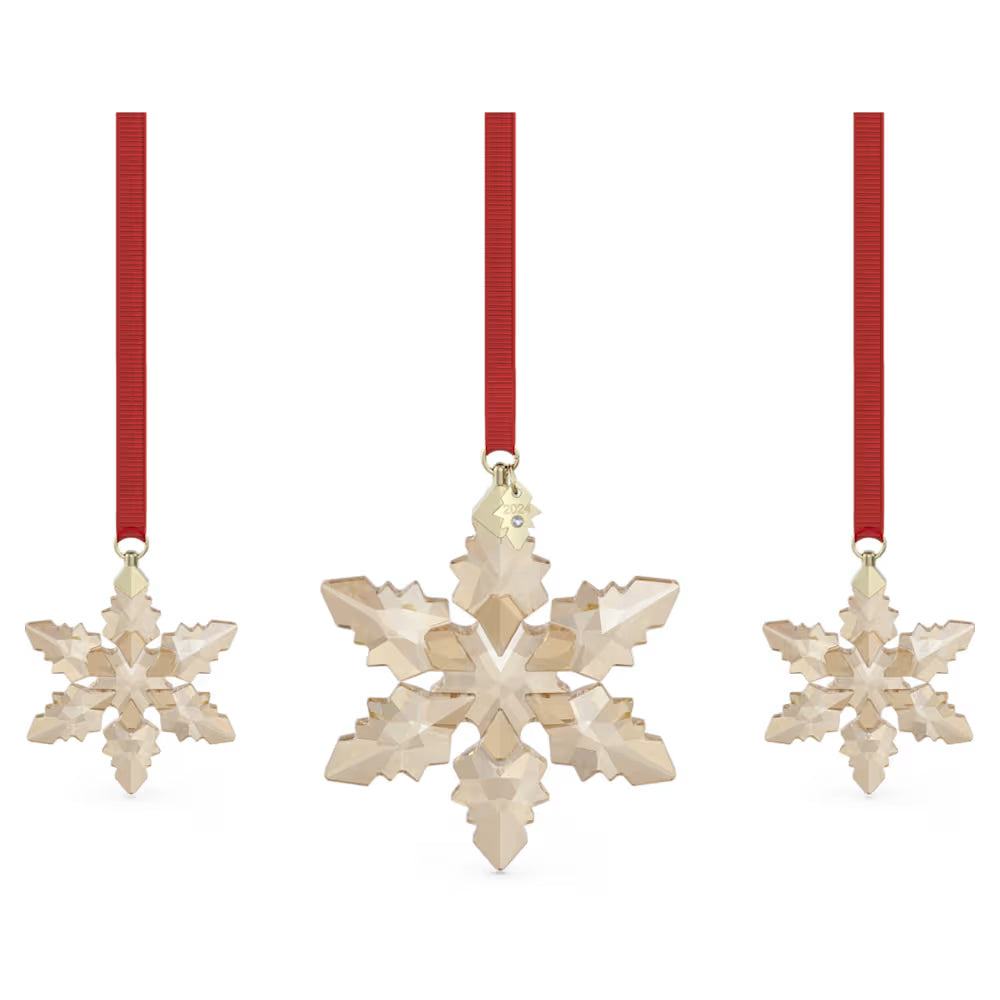 Gold Swarovski crystal set of three christmas ornamnents hanging from red ribbons.